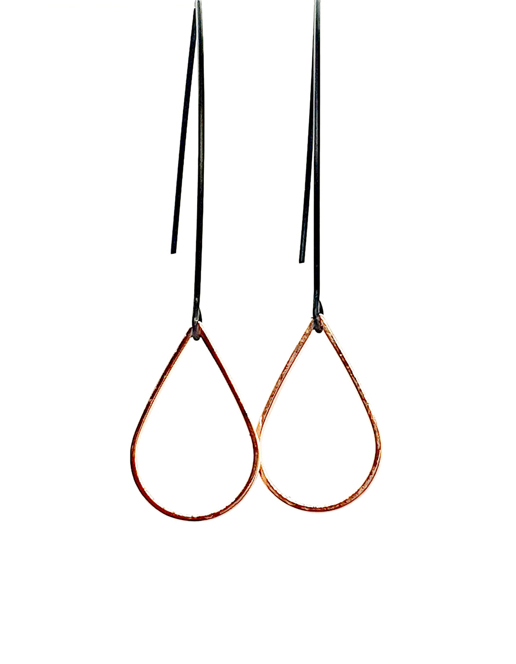 Rose gold tear drop on black dangles
